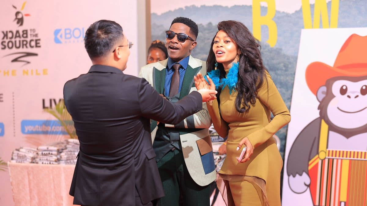 Director Derrick Ssenyonyi (Center) and Ambassador Judith Nsababera (Right) share a moment with a guest at the film's Ugandan Premiere on Saturday in Kampala. PHOTO/COURTESY
